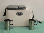 Vector Thermoelectric Travel Cooler And Warmer Model VEC223 With Coffe Mug Nob Open. Price: $60.00.