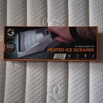 Heated Ice Scraper New. Price: $20.00.