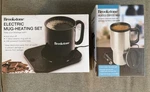 Brookstone Heated Coffee Mug 12V Electric Heating Set Lot New. Price: $22.99.